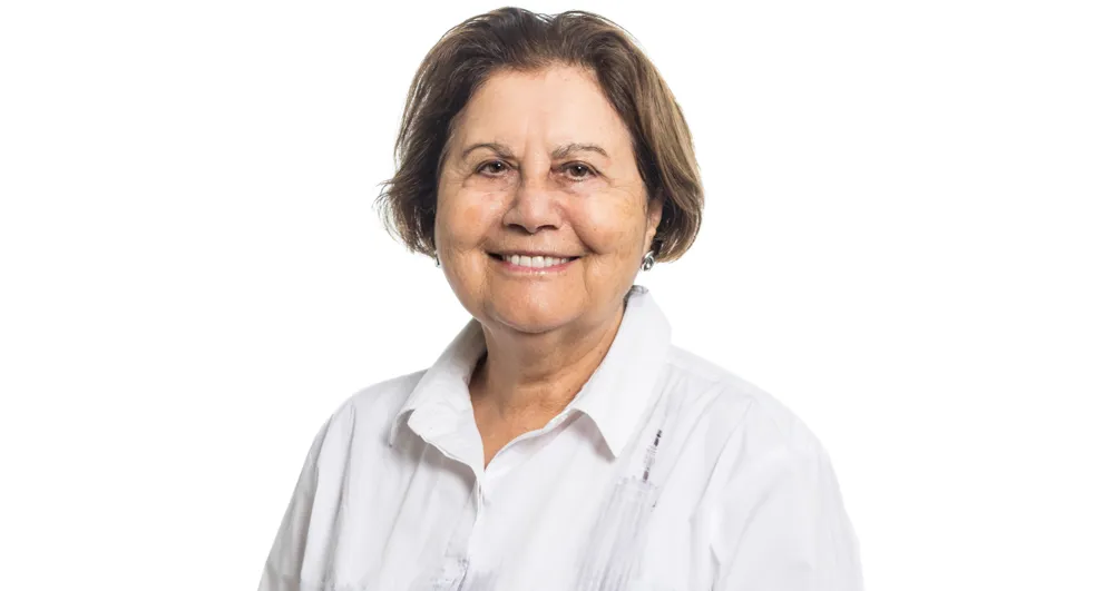 Ms Kate George wearing a black blazer, with a blue shirt.