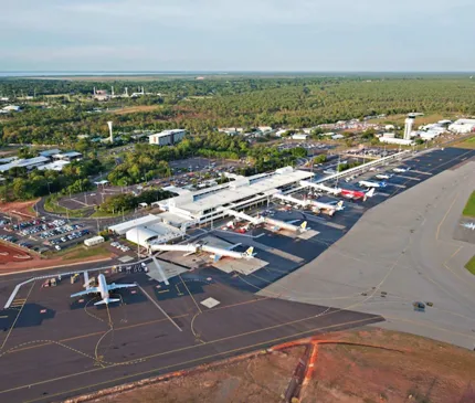 Aerial View Of Darwin Airport With Planes Terminal And Runway on Take off for airport upgrades across the NT