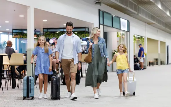 Queensland Airports Limited Townsville Airport Redevelopment Family Wheeling Luggage Father Mother And Two Daughters