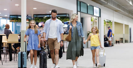 Redevelopment of Townsville Airport - Family walking through the airport