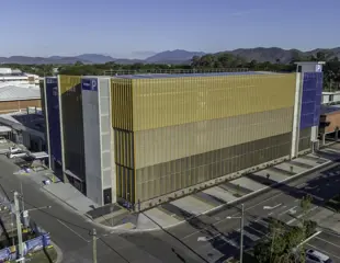 Mater Health Multi Storey Carpark Townsville Aerial View Yello Wand Blue Exterior Mountains In Background
