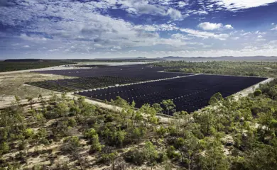 Genex Kidston Pumped Storage Hydro Project Aerial View Of Solar Farm And Panels With Trees In The Foreground And Blue Sky
