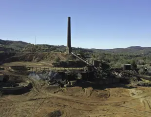 Heritage Minerals Mount Morgan Gold And Copper Tailings Reprocessing And Rehabilitation Chimney Stack Coneyor Belt Brown Dirt And Abandoned Buildings