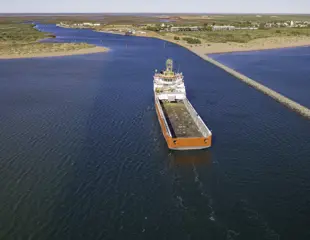 Onslow Marine Support Base Aerial View Of Ship Going Into River Mouth