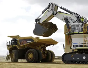 Pembroke Olive Downs Steelmaking Coal Project Large Digger Loading Orange Mining Truck Full Of Dirt