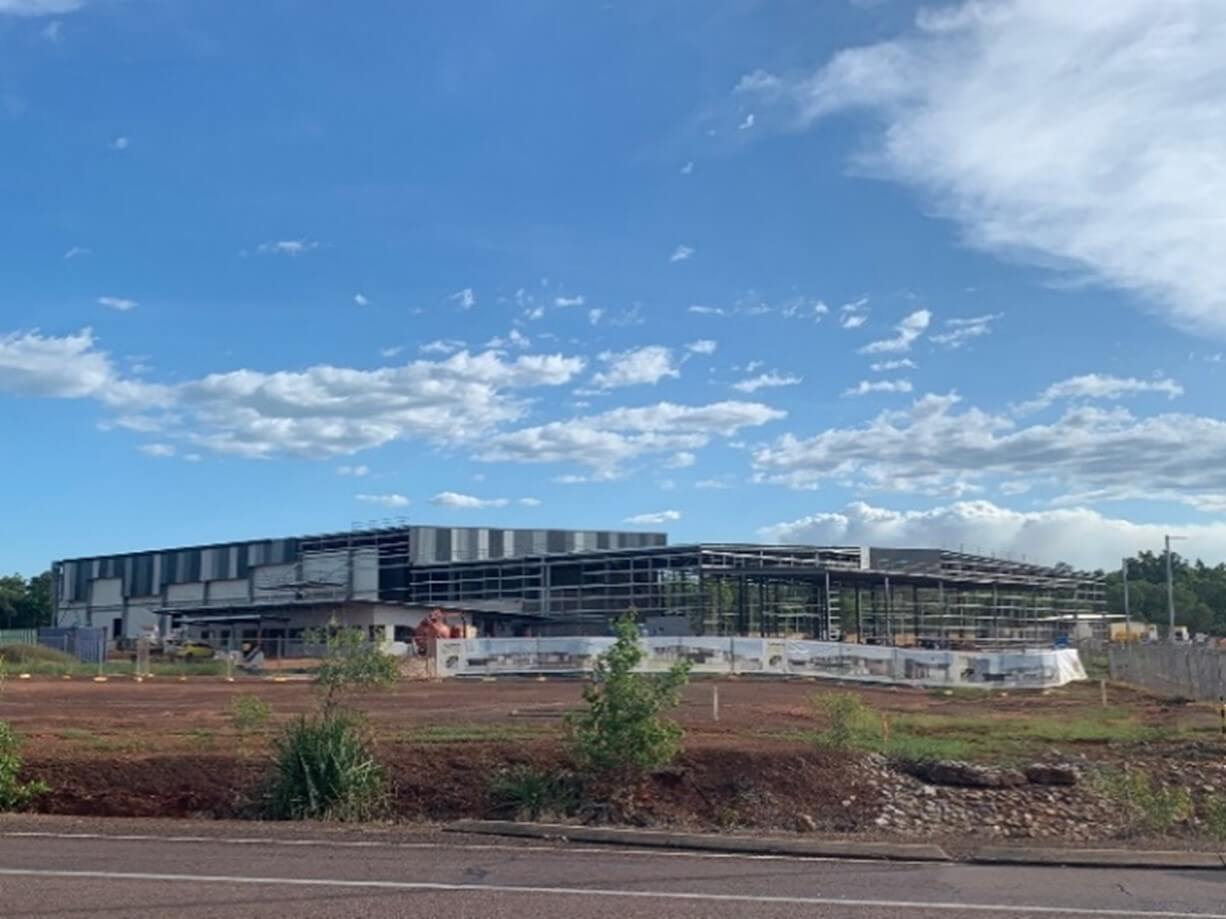 Cold Storage Facility under construction blue sky, scaffolding and red dirt