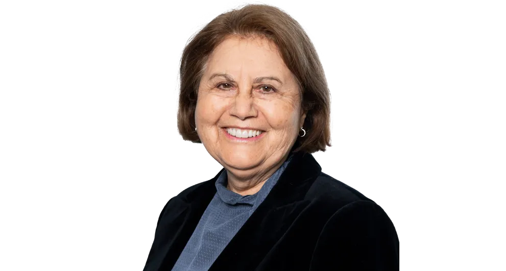 Ms Kate George wearing a black blazer, with a blue shirt.