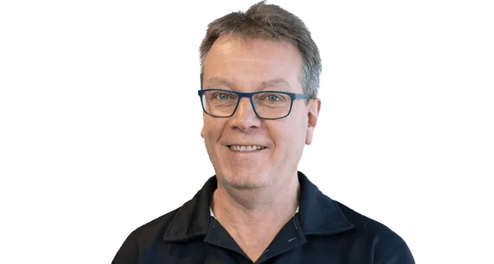 Mr Jim Betts wearing a black button up shirt.