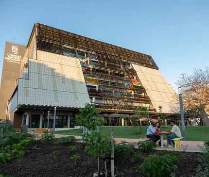Charles Darwin University Education And Community Precinct Artist Render Exterior Slanted Roofline Trees And Sky on City and Casuarina Campus Project