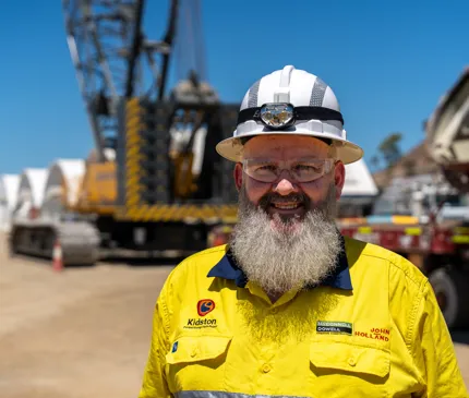 Sean Hughes wearing PPE glasses, hat, shirt at the Genex Power Kidston pumped storage hydro project