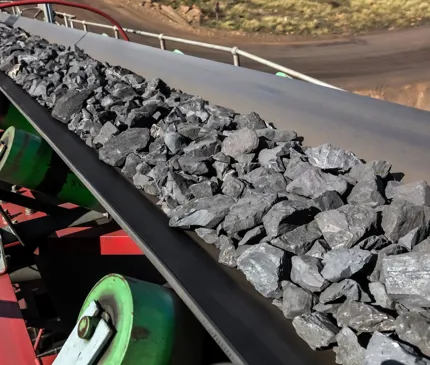 Manganese rocks travelling down a conveyor belt