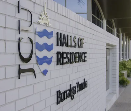 JCU Halls Of Residence Front Entrance Signage Jcu Logo White Brick Wall Burralga Yumba