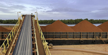 Bauxite Hills Mine Stage 2 Expansion - Men standing in front of a mining machine